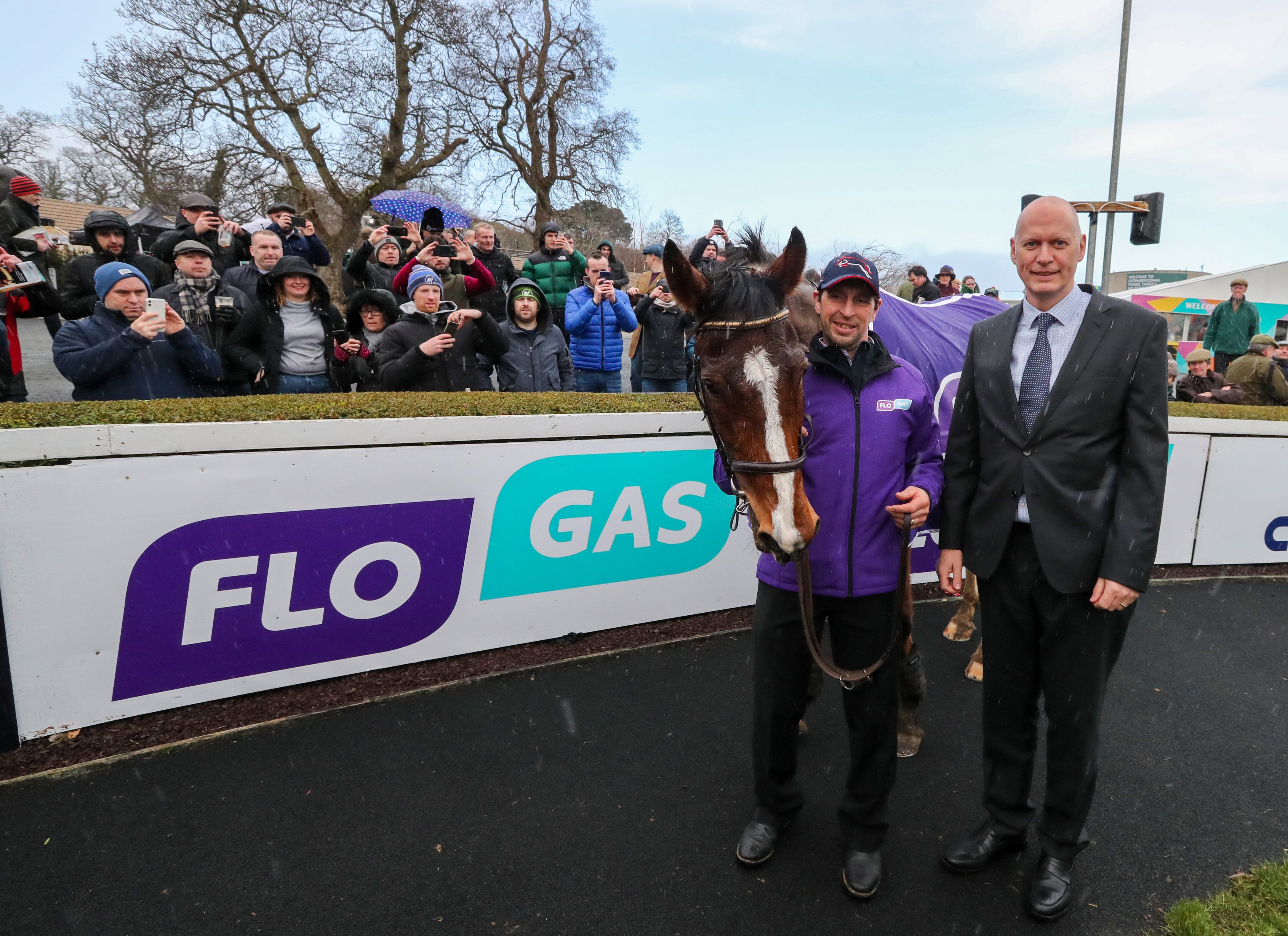 John Rooney, managing director, Flogas with Faugheen, winner of the Flogas Novice Chase and his groom John Codd at the Dublin Racing Festival in Leopardstown on Sun 2nd February 2020